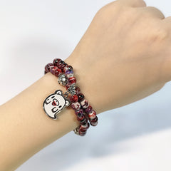 Charming beaded bracelet with cute character charms pendants.