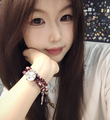 Charming beaded bracelet with cute character charms pendants.