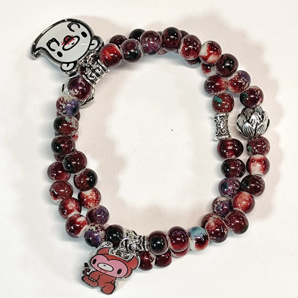 Charming beaded bracelet with cute character charms pendants.